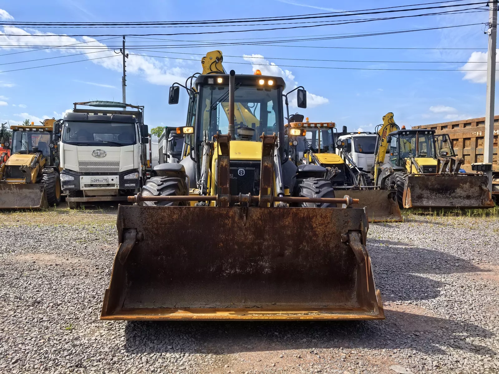 New Holland B115B Экскаватор-погрузчик