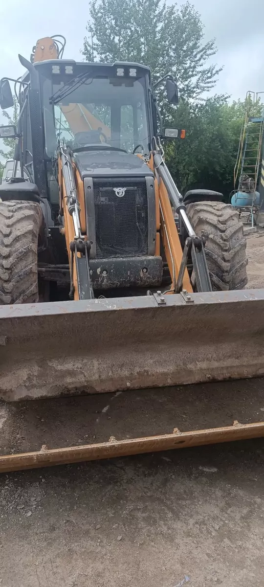 Case 695SV Экскаватор-погрузчик
